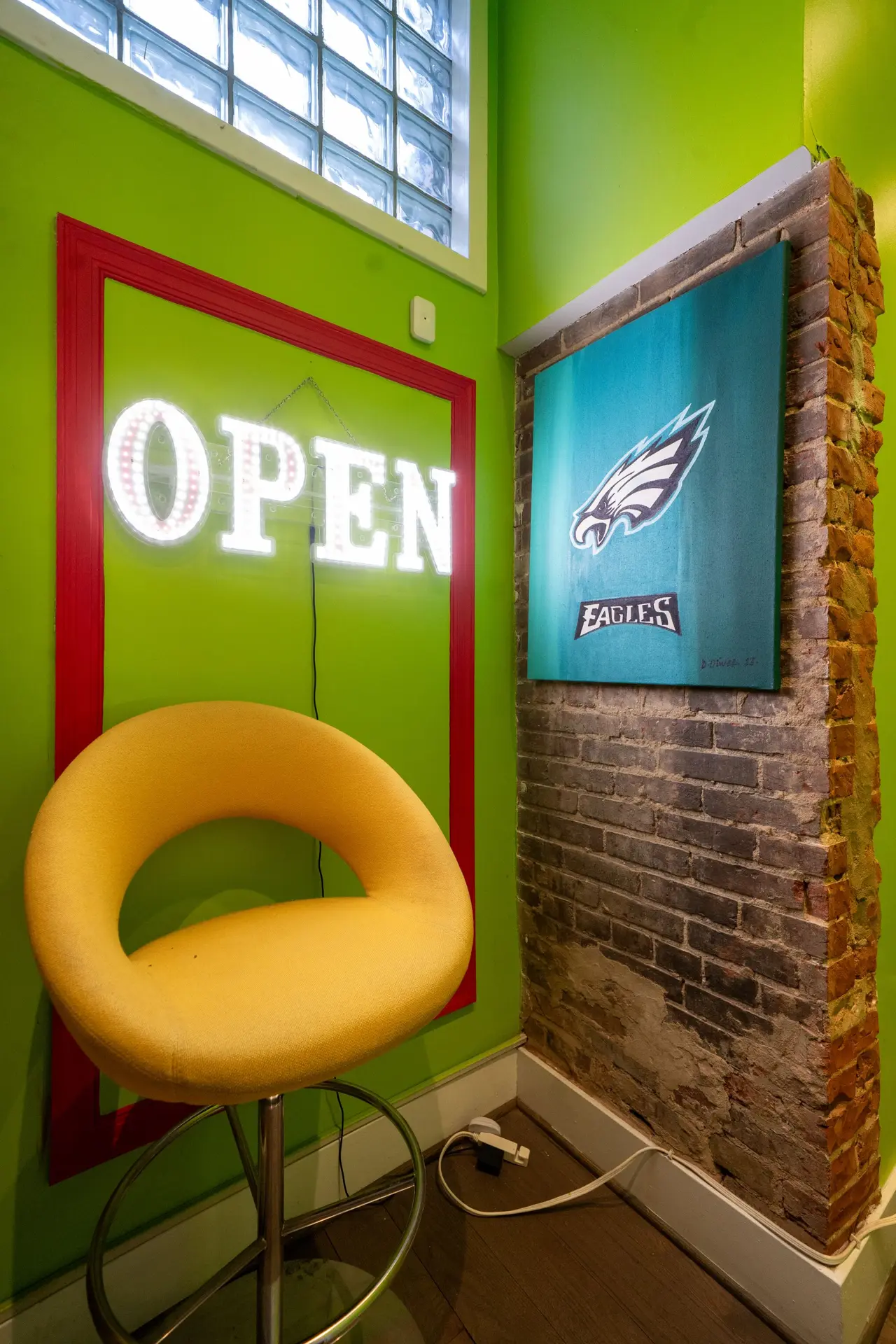 Open sign and lime green wall at District Gaslight